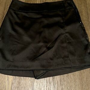 Ladies' size S black skort with tag.